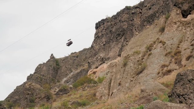 Manual trolley hoist with a cargo at the Monastery of Vardzia, Georgia