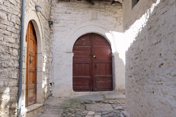 Fototapeta na wymiar medieval street with wooden door in Berat city, Albania