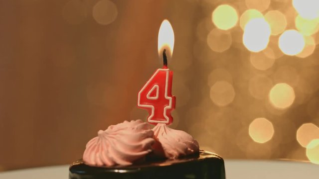 Birthday or anniversary candle on cake