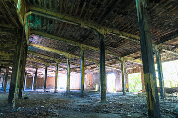 Fire damaged interior of a large train roundhouse and depot in upstate New York