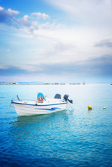 Fishing boat floating in water of Zaante town, beautiful detail of Zakinthos island, Greece, retro toned
