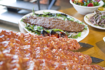 raw kebab and kebab, salad