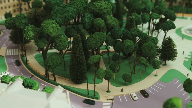 Close up shot of architecture model of the modern city with park. View from the top.