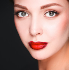 Naklejka premium Close up portrait of beautiful young woman face