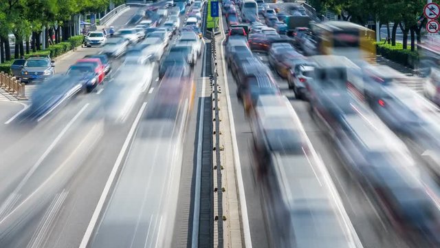 Time lapse of busy traffic and modern buildings in Beijing city , China.