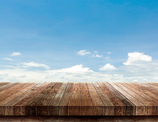 wood shelf on blue sky background