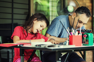 The family draws on the terrace in the summer