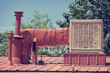 Old swamp cooler or evaporative cooler to show how bad the old units are with calcium build-up compared to new A/C. This is located in New Mexico, US.
 - obrazy, fototapety, plakaty