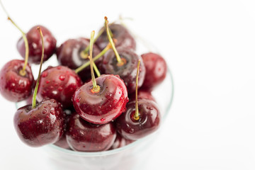 Sweet Fresh Red Cherries with Water Drops on White Background