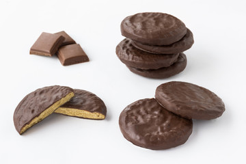 Round chocolate cookies on a white background