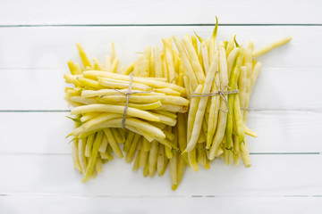 Yellow kidney bean on a wooden background in natural light