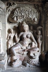 Sculpture of Indrani under  a mango tree Ellora caves India
