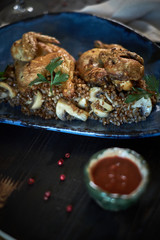 Grilled chicken Tabaka with sauce on stone plate. jpg