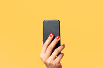 Young woman holding a mobile phone