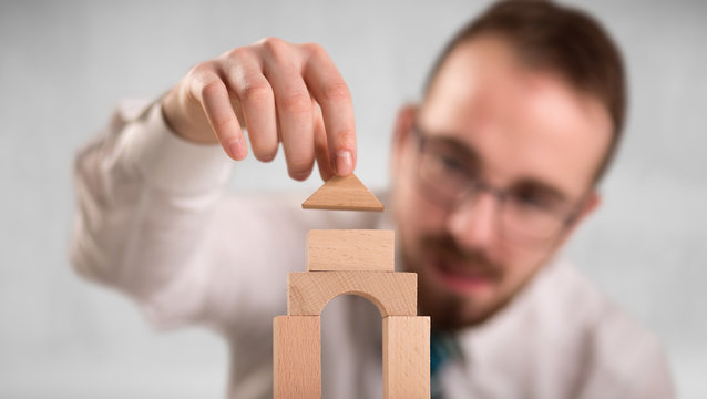 Businessman building a tower