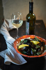 Mussels on ice ready to cook with lemon and white wine jpg