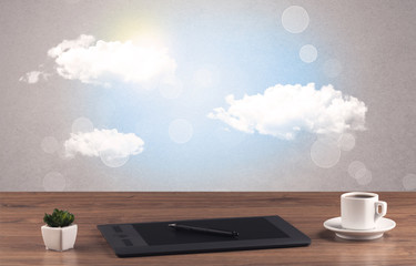 Bright sky with clouds and office desk