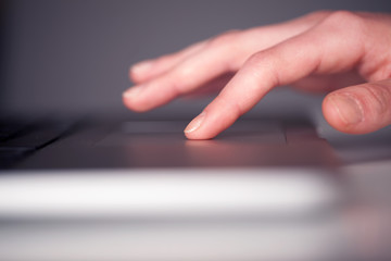 Close up of hand pressing keyboard buttons