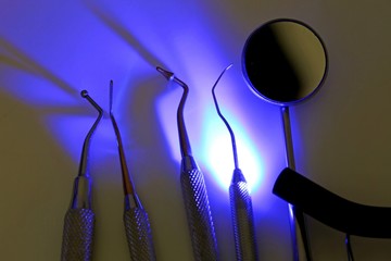 Dental tools for tooth cleaning and ultraviolet light for steril