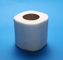Toilet paper roll isolated on blue background