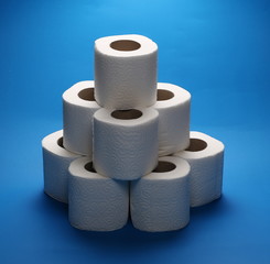 Toilet paper rolls isolated on blue background