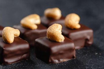 Handmade chocolate bonbons with cashew