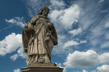 Fototapeta na wymiar Medieval statue of a king on the old Main bridge
