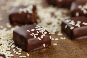 Handmade chocolate candies with sesame seeds