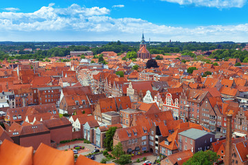 Obraz premium City landscape. View from the top of the German city of Luneburg. View of the roofs of the old city in Germany.