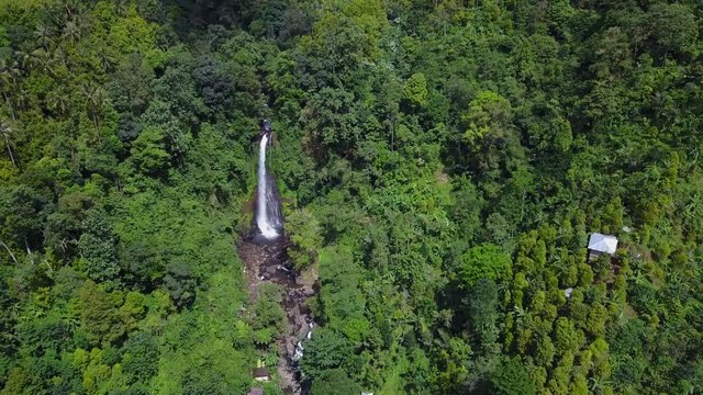 Beautiful aerial scenery footage of Gitgit waterfall and tropical forest in Bali, Indonesia. Shot in 4k resolution