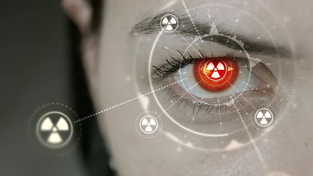 Young cyborg female blinks then nuclear symbols appears. 4K+ 3D animation concept.