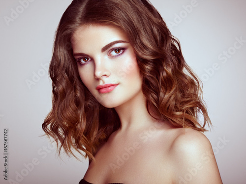 Brunette Woman With Long And Volume Shiny Wavy Hair Beautiful