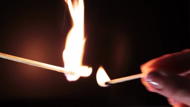 Ignition of a match on a black background