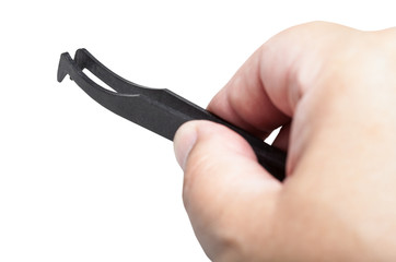 male hand with black plastic anti-static tweezers