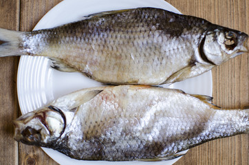  Freshwater fish. dried fish.  salty fish on the wooden table. 