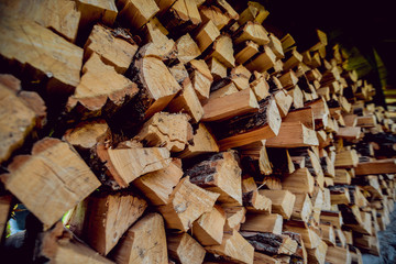 A lot of firewood outdoor. Cross section of the timber.