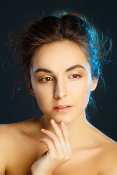 Beauty portrait of young pretty woman in studio. Face care concept.
