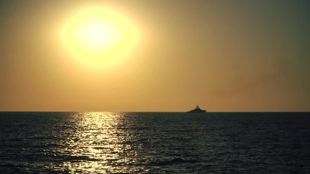 Ship and Sunset Over The Sea