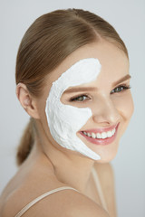 Face Mask. Portrait Of Beautiful Smiling Girl With White Mask