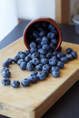 Blueberry on wooden background. Ripe and juicy fresh picked blueberries closeup