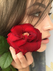 Selfie beautiful young girl with Rose