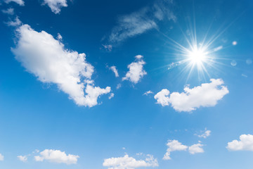 Blue sky background with the sun,Blue sky with white clouds floating in the sky.
