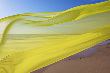 yellow tissue flying over the sea