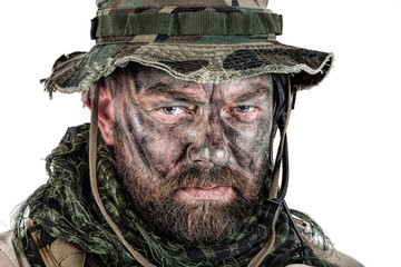 Special forces United States in Camouflage Uniforms studio shot. Wearing jungle hat, Shemagh scarf, painted face. Studio shot isolated