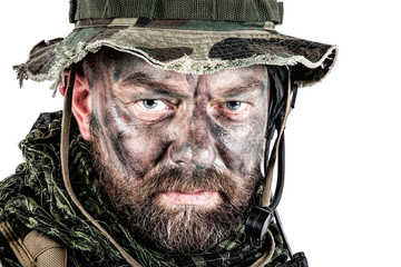 Special forces United States in Camouflage Uniforms studio shot. Wearing jungle hat, Shemagh scarf, painted face. Studio shot isolated