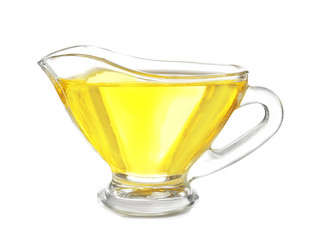 Gravy boat with cooking oil on white background