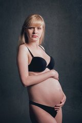 Picture of beautiful nude pregnant woman.