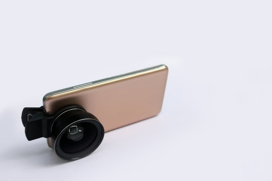 Clip lens with mobile phones in white background.
