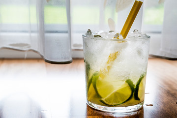Caipirinha Cocktail with lime and ice.