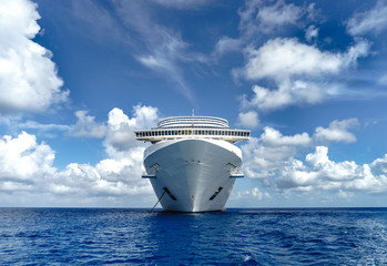 Cruise ship in crystal blue water with blue sky
